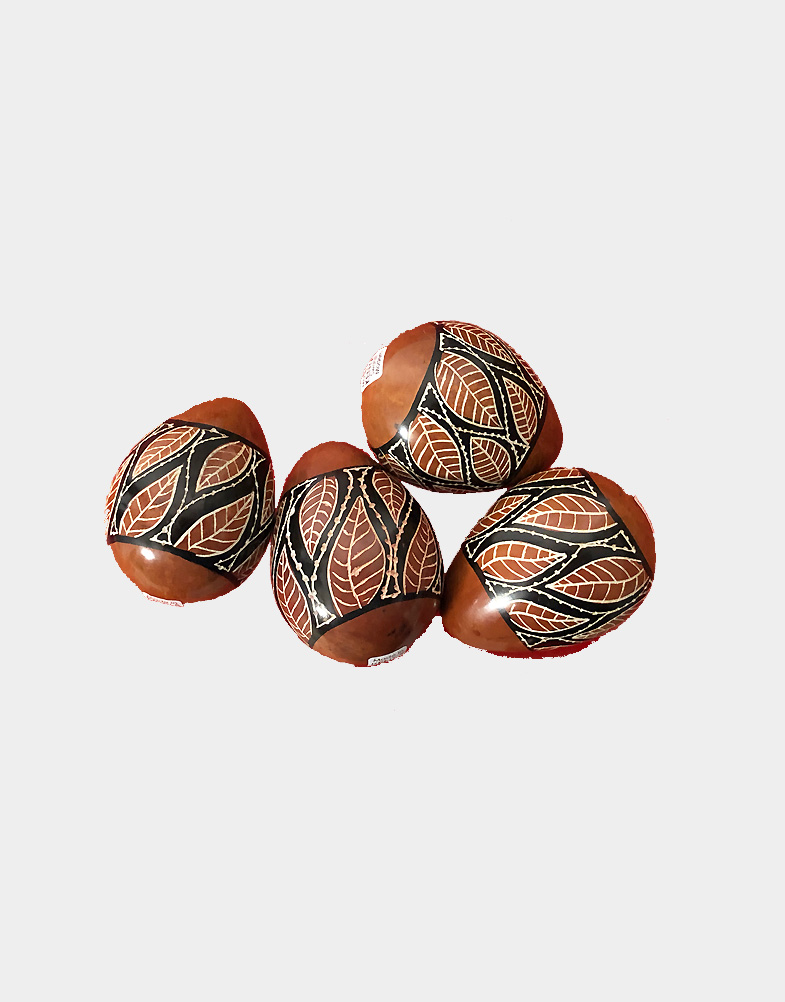 These decorated Easter eggs are handcrafted from soap stone by the Kenyan artists in Kenya's western highlands. Hand dyed and etched in vibrant terracotta color.