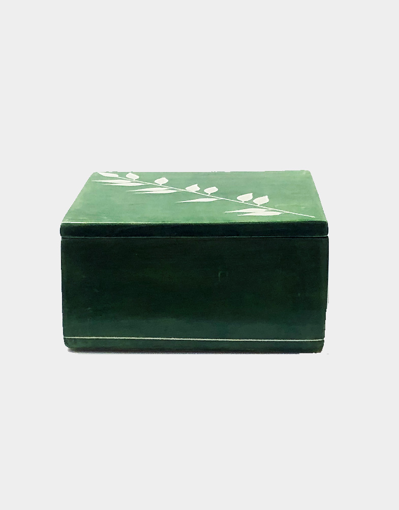 Kenyan artisans hand carve & etch soft soapstone to create a square box with a simple bamboo design. A sponge-dyed green finish blankets this unique home decor.