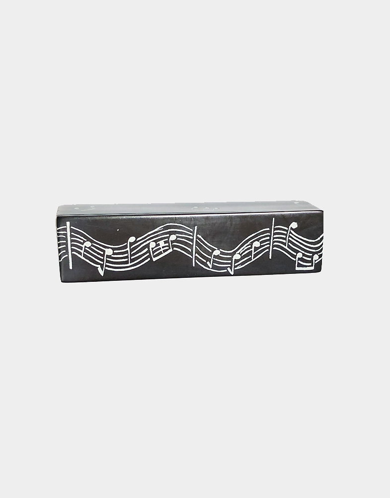 Kenyan artisans adorn hand carved soapstone boxes with a stained black exterior and hand-etched musical staffs and notes. Shop with ree shipping.