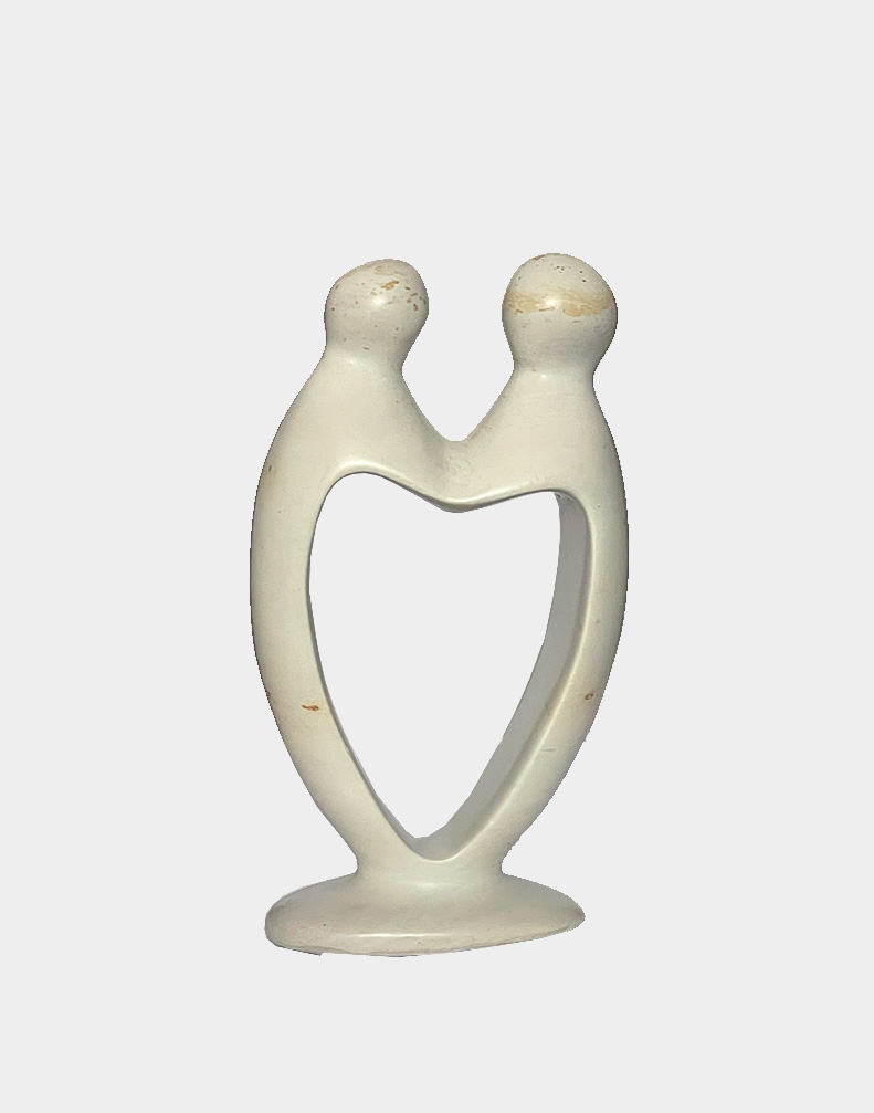 Hand-carved from a single piece of Kisii soapstone by African artisans, this sculpture depicts the sweet love of a couple holding hands. Shop with free shipping.