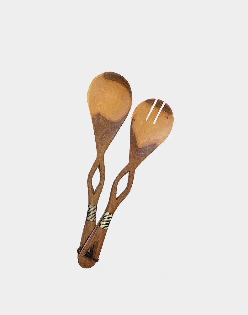 Wild olive wood is a preferred carving medium of wood carvers of Kenya. These nice salad servers feature an eyelet design and cow bone inlay. Free shipping.