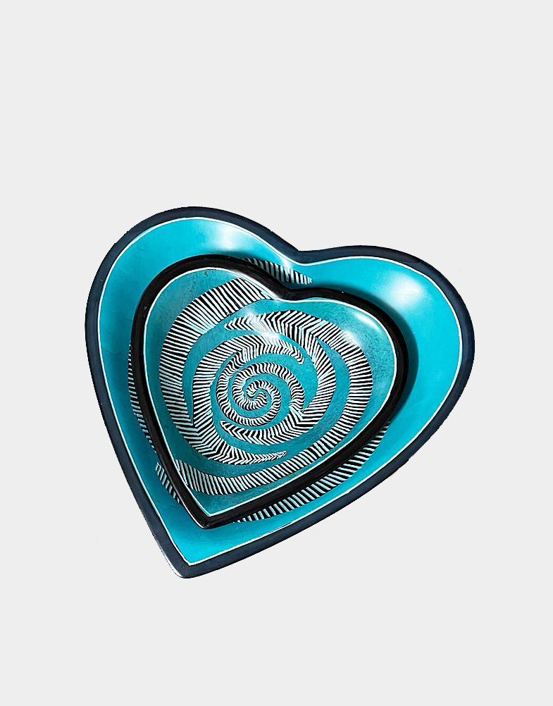 Kenyan artisans hand carve beautifully contoured heart-shaped nesting dish set from soft soapstone, then stain each piece with aqua blue and black dye. Buy now!