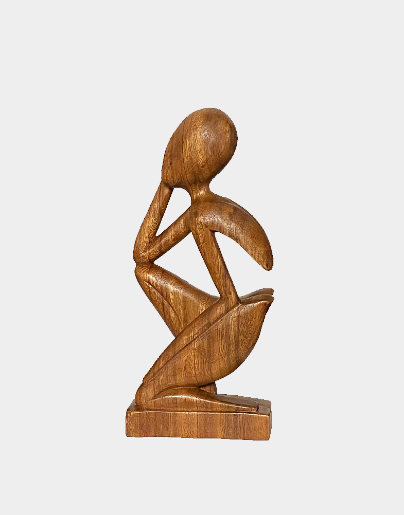 This abstract wood sculpture depicts a body with an empty space where her heart should be. It is he strength of her will that keeps her body together.