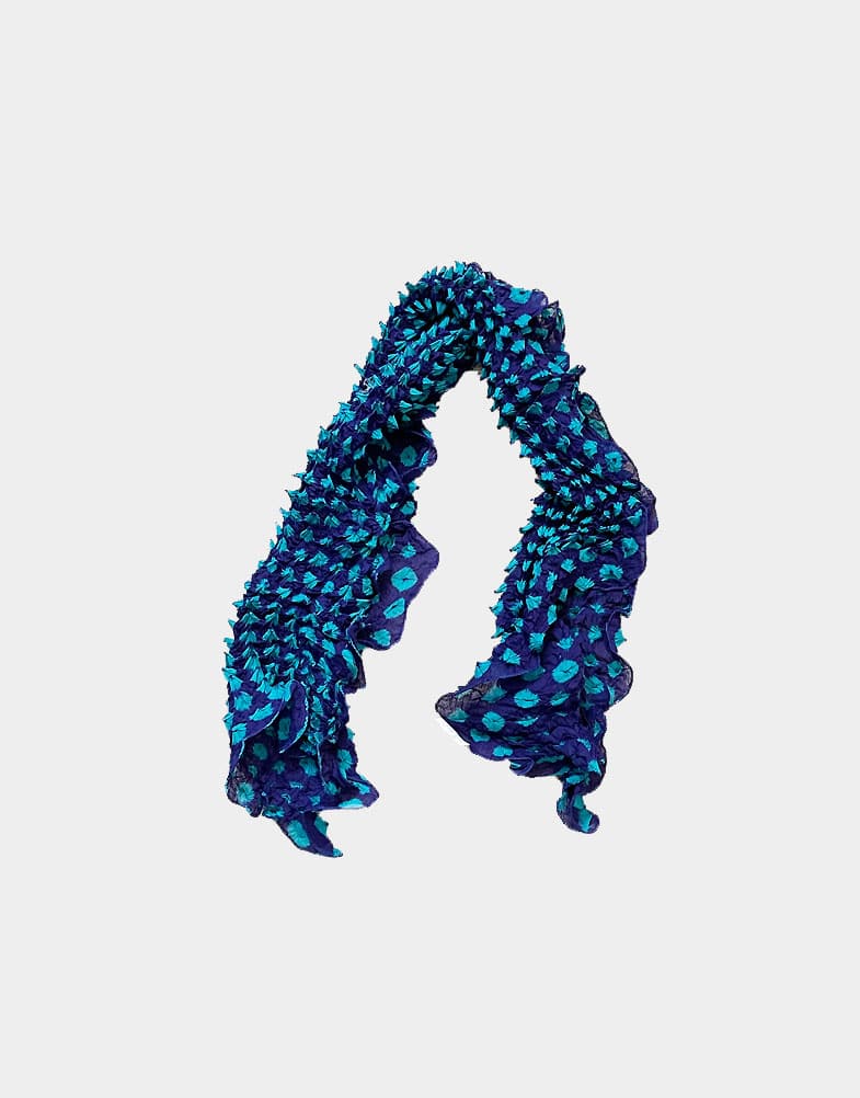 These fair trade cotton scarves are soft and vibrant, and the beautiful hand tie dye patterns give these a natural textured effect in shades of navy and turquoise.