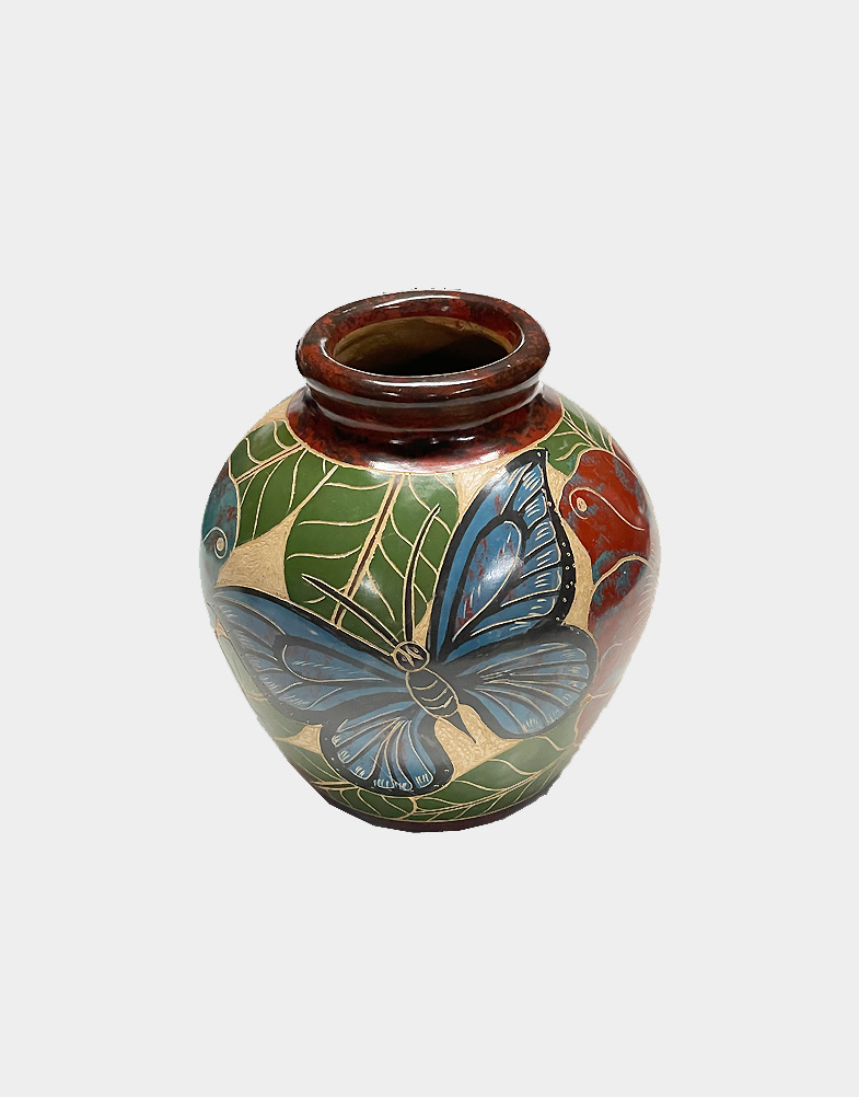 These decorative pots from Nicaragua come in varied motif, colors and elaborately etched patterns, one decorated with humming bird motif while the other with butterflies. Shop at Craft Montaz.